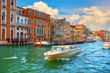 Venice, Italy. Veneto region. Motorboats moving by Grand Canal.
