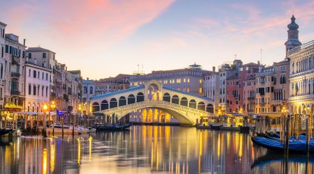 Cityscape image of Venice, in Italy during sunrise with Gondolas